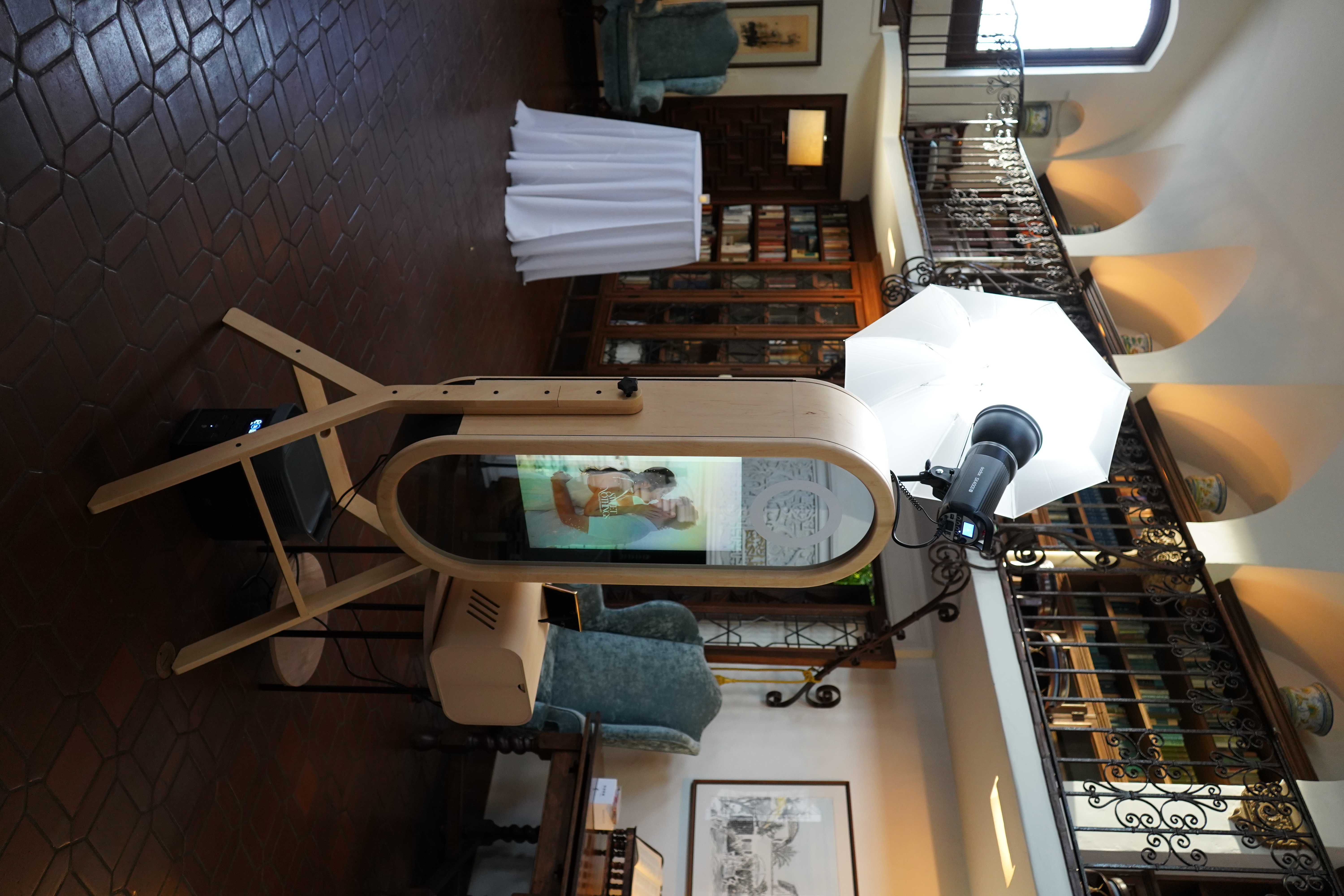 aesthetically pleasing wooden mirror photobooth with a backdrop of a Moorish-inspired design