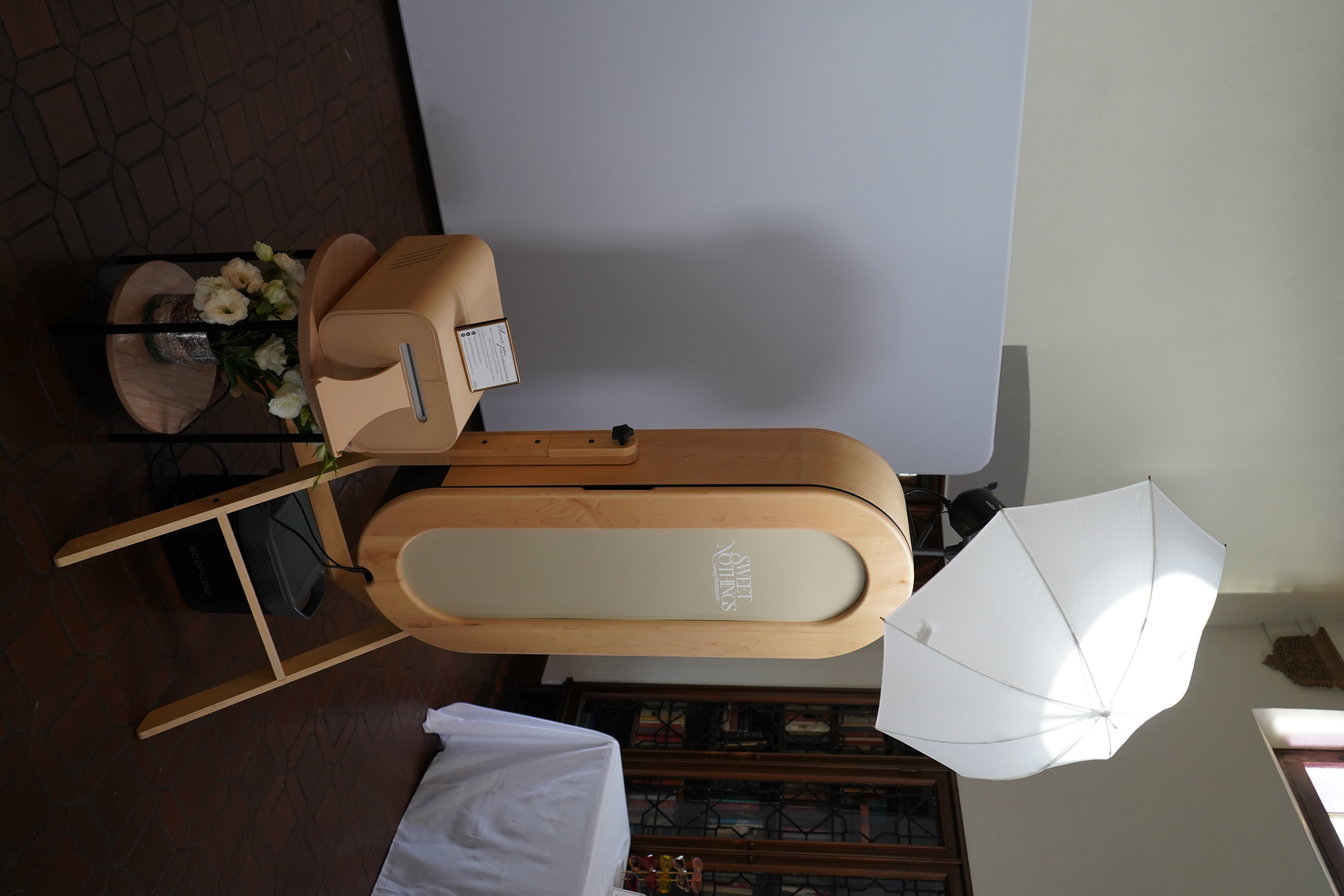 Elegant wedding photobooth setup with rustic charm