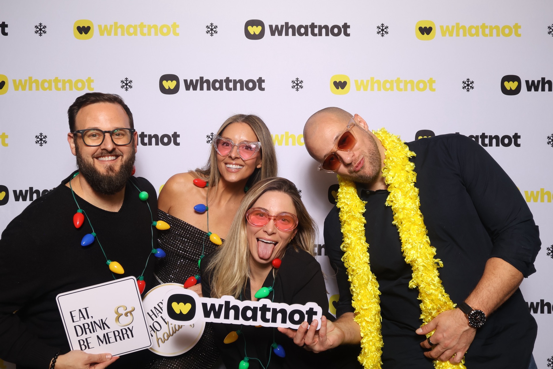 Guests reacting to their photobooth photos