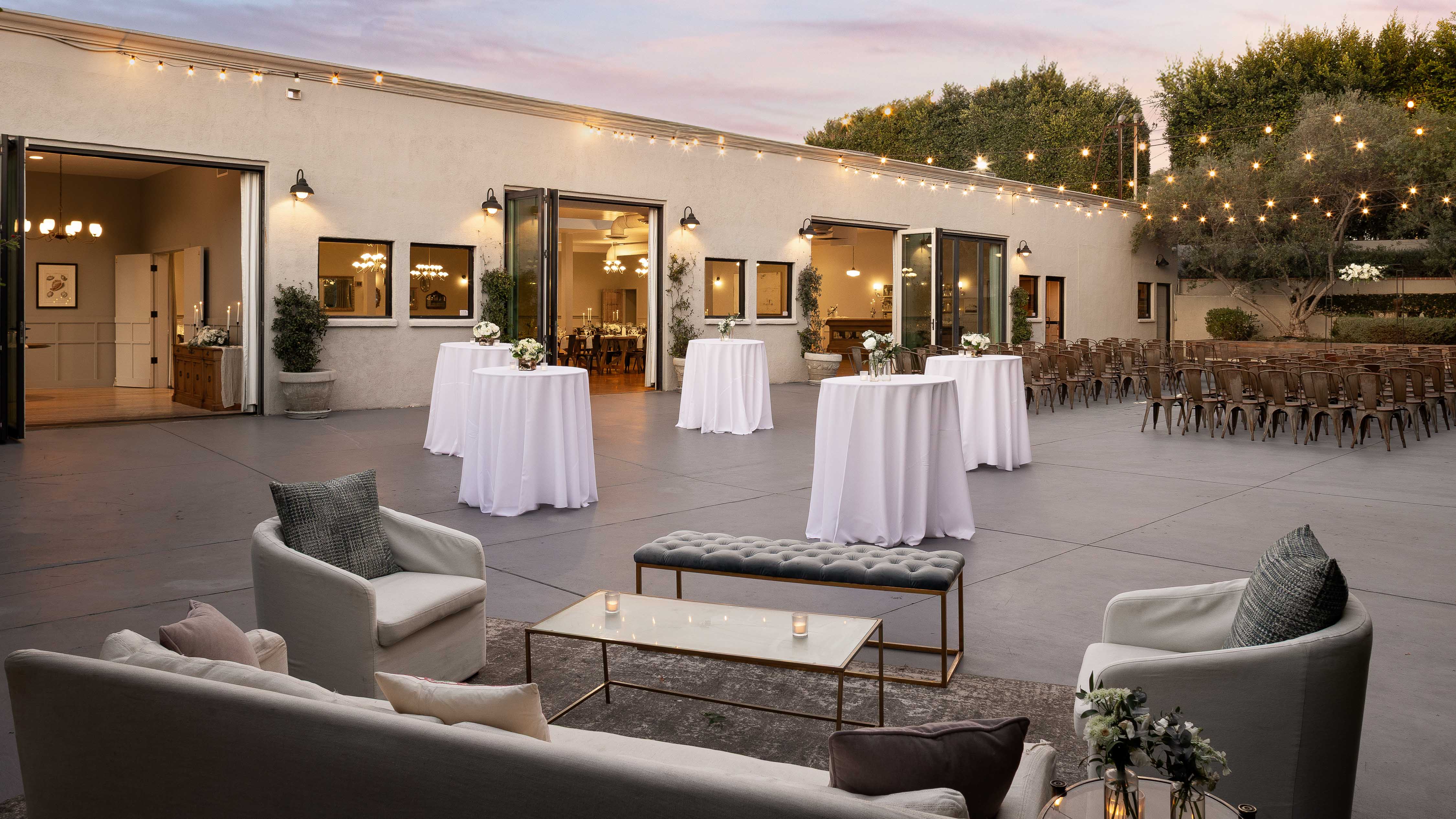 Outdoor cocktail hour and ceremony area at The Harper by Wedgewood Weddings